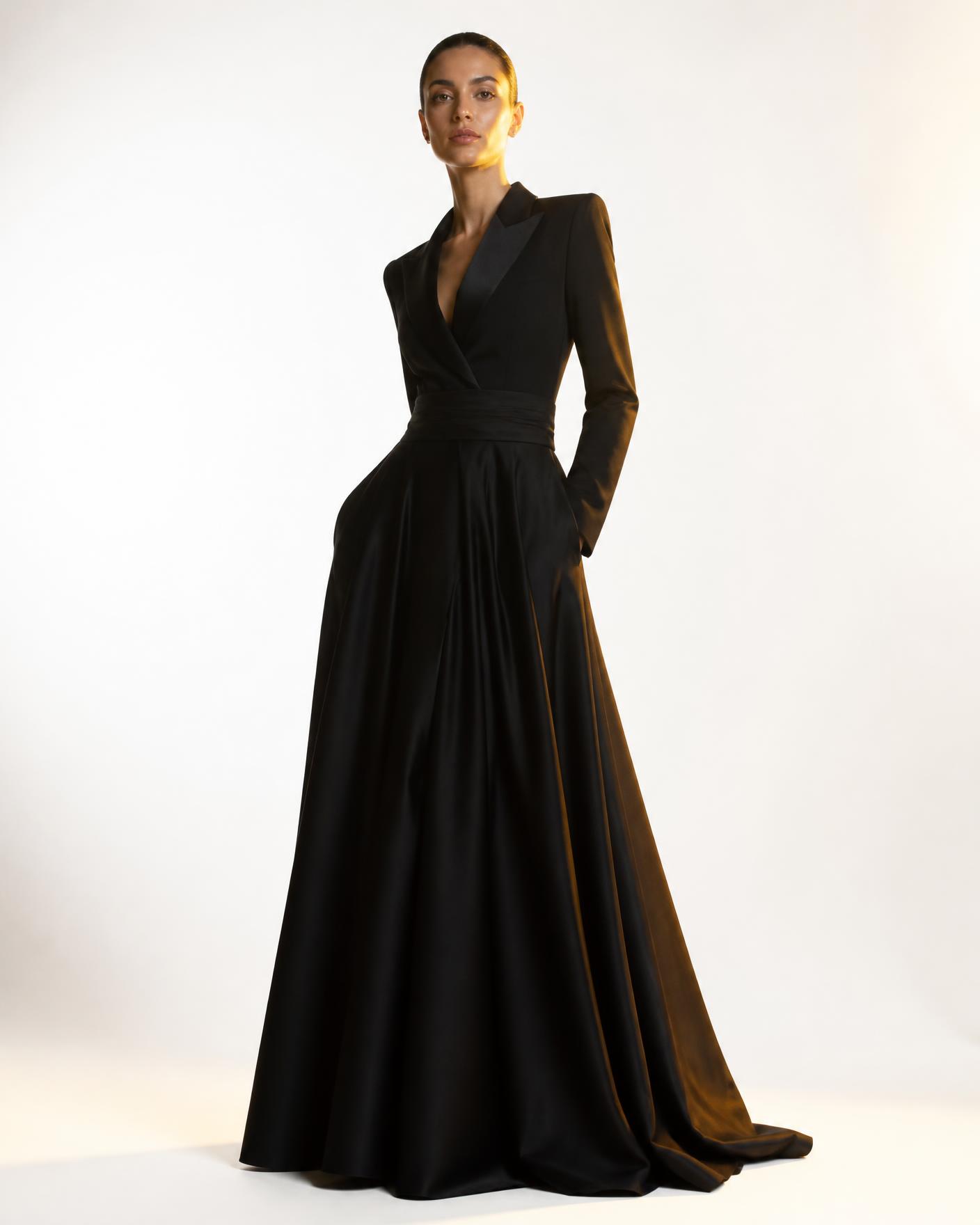 Model in a black couture gown photographed in a bright studio